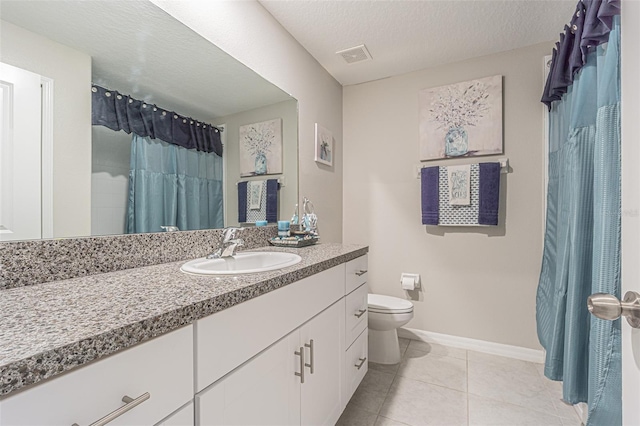 13527 Willow Bluestar Loop, Riverview, FL 33579 - bathroom featuring vanity, tile patterned floors, curtained shower, and a textured ceiling