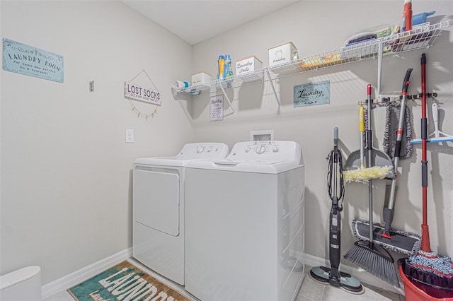 13527 Willow Bluestar Loop, Riverview, FL 33579 - laundry area with washing machine and clothes dryer and tile patterned flooring