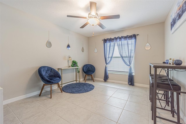 13527 Willow Bluestar Loop, Riverview, FL 33579 - living area featuring a ceiling fan, a textured ceiling, and light tile patterned floors