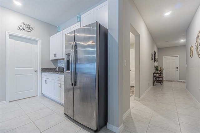 13527 Willow Bluestar Loop, Riverview, FL 33579 - kitchen featuring stainless steel fridge, white cabinetry, light tile patterned floors, and recessed lighting