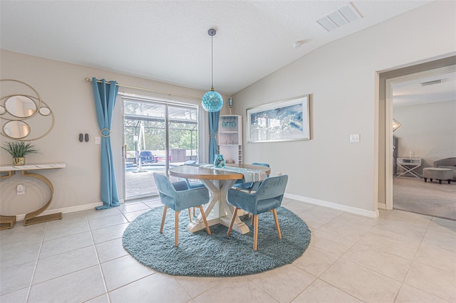 13527 Willow Bluestar Loop, Riverview, FL 33579 - dining area featuring light tile patterned floors and vaulted ceiling