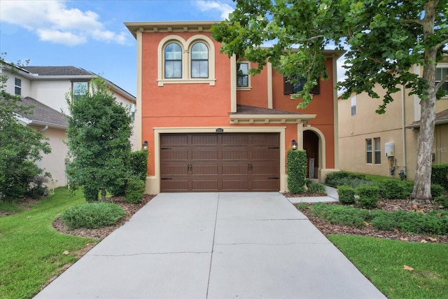 3994 Medicci Ln, Wesley Chapel, FL 33543 - view of front facade with an attached garage, concrete driveway, stucco siding, and a front lawn