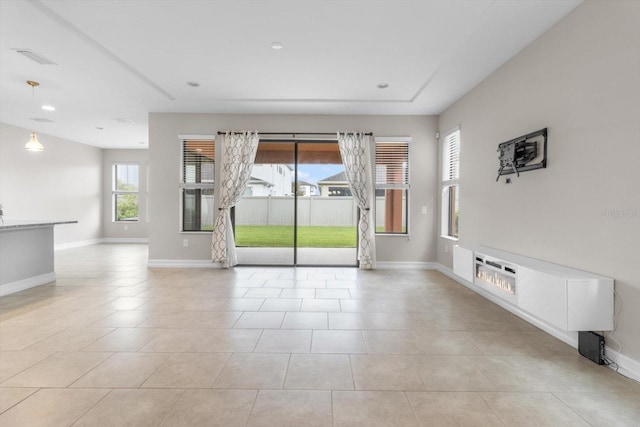3994 Medicci Ln, Wesley Chapel, FL 33543 - empty room featuring baseboards and light tile patterned floors