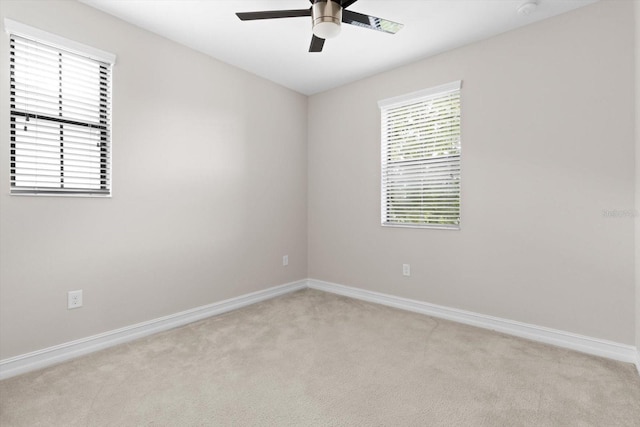 3994 Medicci Ln, Wesley Chapel, FL 33543 - spare room with ceiling fan, light colored carpet, and a smoke detector