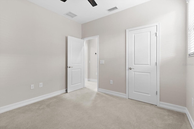3994 Medicci Ln, Wesley Chapel, FL 33543 - unfurnished bedroom with light carpet and ceiling fan
