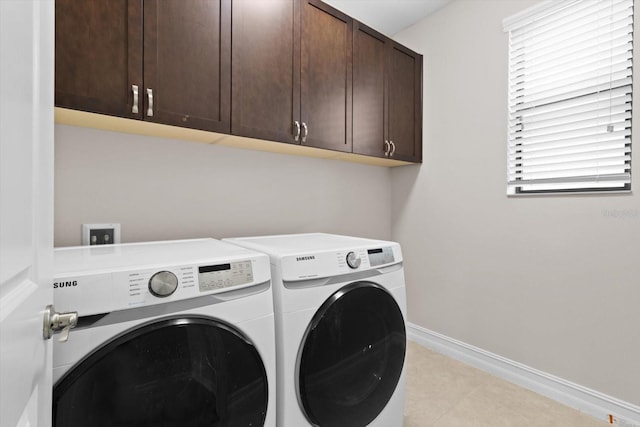 3994 Medicci Ln, Wesley Chapel, FL 33543 - laundry area with cabinet space, washing machine and clothes dryer, and light tile patterned floors
