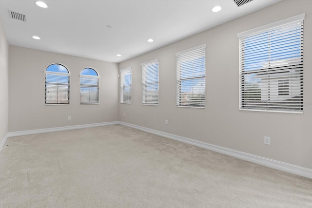 3994 Medicci Ln, Wesley Chapel, FL 33543 - empty room featuring light carpet, recessed lighting, and plenty of natural light