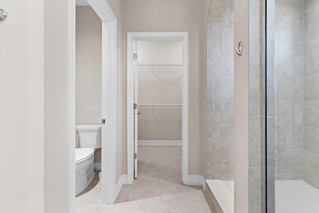 3994 Medicci Ln, Wesley Chapel, FL 33543 - full bathroom featuring a shower stall, a walk in closet, and tile patterned flooring
