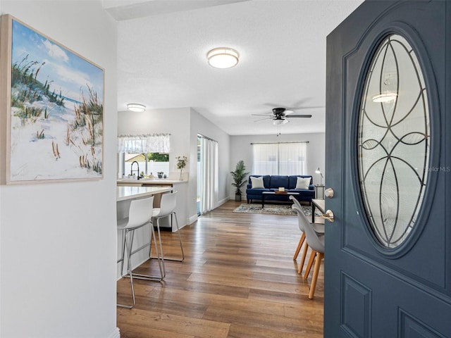 1675 E Grovehill Rd, Palm Harbor, FL 34683 - foyer with ceiling fan and wood finished floors