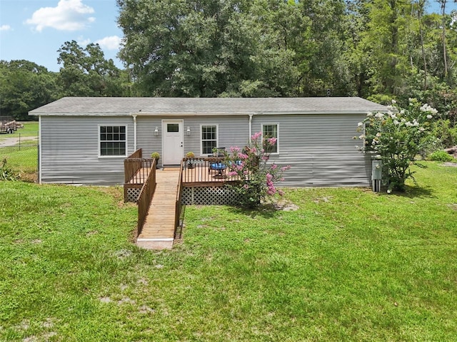 26223 Chianina Dr, Wesley Chapel, FL 33544 - rear view of property with a deck and a yard