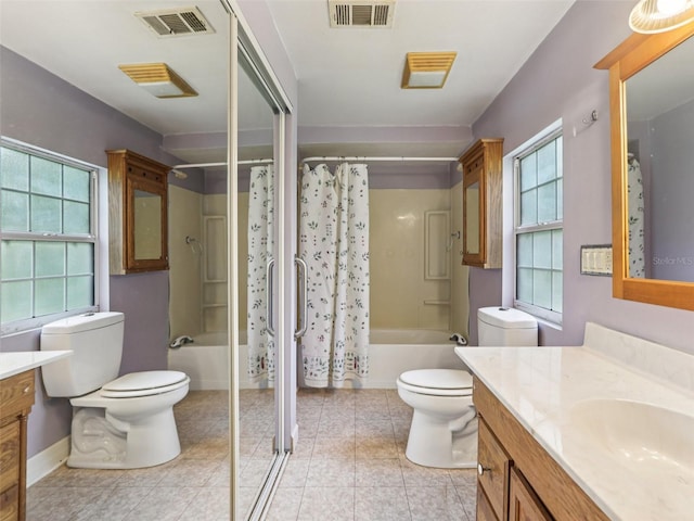 26223 Chianina Dr, Wesley Chapel, FL 33544 - bathroom with vanity, shower / bath combo, healthy amount of natural light, and tile patterned floors
