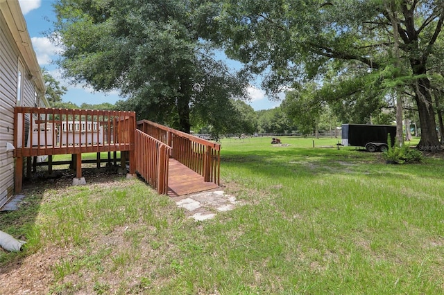 26223 Chianina Dr, Wesley Chapel, FL 33544 - view of grassy yard with a deck