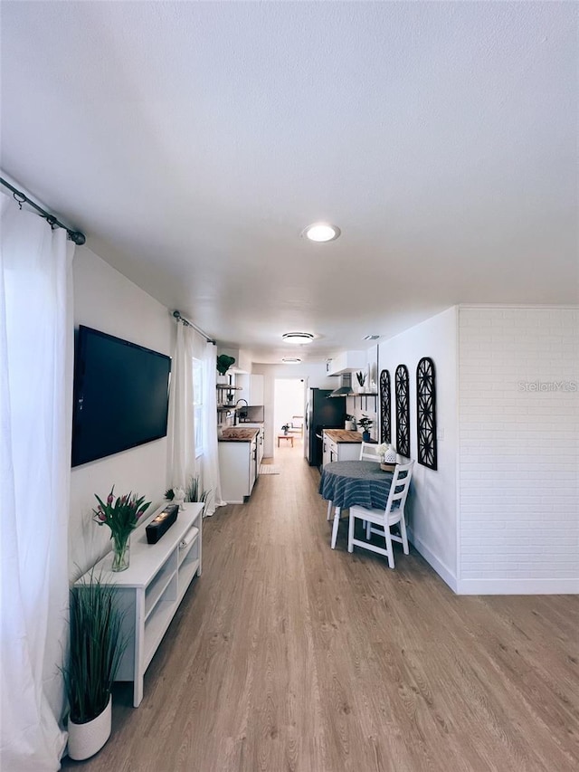 368 6th St NW, Largo, FL 33770 - living room with light wood-style flooring and recessed lighting