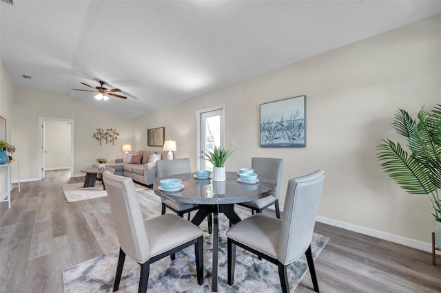 1561 S Martin Luther King Jr Ave, Clearwater, FL 33756 - dining area with wood finished floors, a ceiling fan, and vaulted ceiling