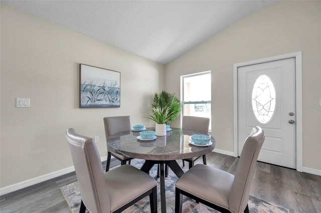 1561 S Martin Luther King Jr Ave, Clearwater, FL 33756 - dining space with vaulted ceiling and wood finished floors