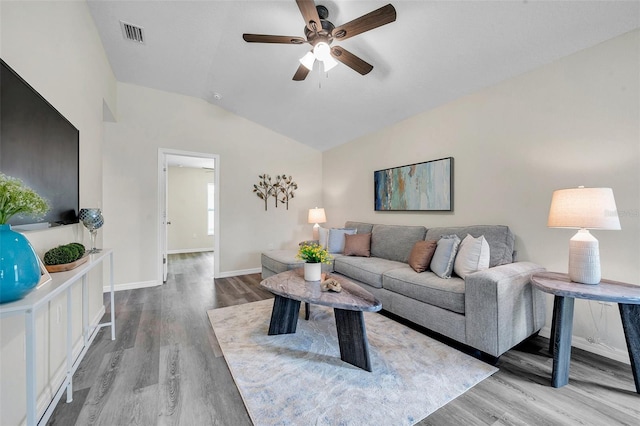 1561 S Martin Luther King Jr Ave, Clearwater, FL 33756 - living room with wood finished floors, vaulted ceiling, and a ceiling fan