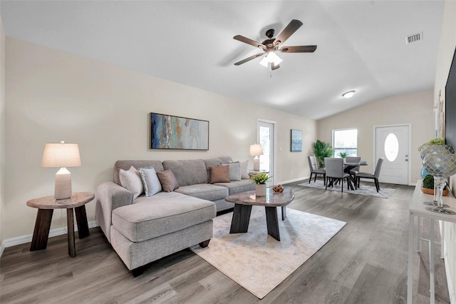 1561 S Martin Luther King Jr Ave, Clearwater, FL 33756 - living room featuring light wood-style floors, lofted ceiling, and a ceiling fan