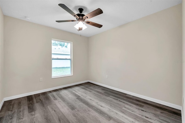 1561 S Martin Luther King Jr Ave, Clearwater, FL 33756 - empty room with wood finished floors, a ceiling fan, and a smoke detector