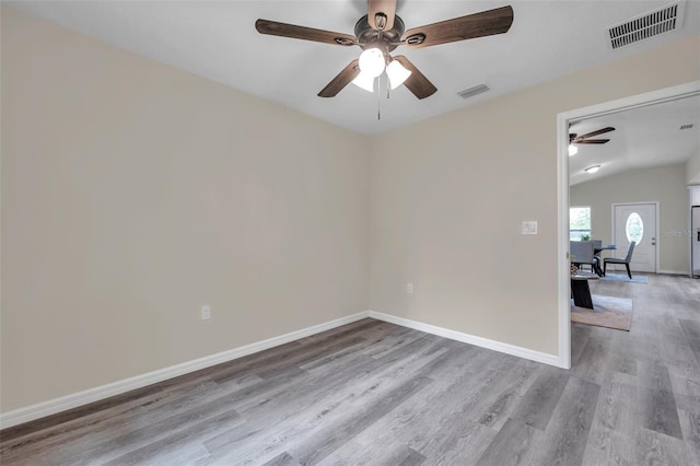 1561 S Martin Luther King Jr Ave, Clearwater, FL 33756 - spare room with ceiling fan, light wood-type flooring, and lofted ceiling