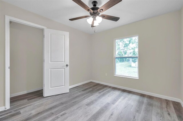 1561 S Martin Luther King Jr Ave, Clearwater, FL 33756 - unfurnished bedroom with light wood-type flooring and a ceiling fan