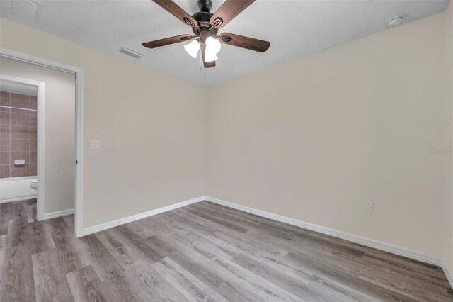 1561 S Martin Luther King Jr Ave, Clearwater, FL 33756 - unfurnished room with a ceiling fan, wood finished floors, and a smoke detector