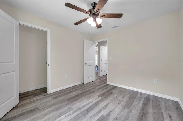 1561 S Martin Luther King Jr Ave, Clearwater, FL 33756 - unfurnished bedroom featuring wood finished floors and a ceiling fan
