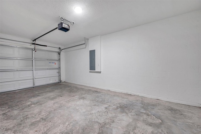 1561 S Martin Luther King Jr Ave, Clearwater, FL 33756 - garage featuring a garage door opener, electric panel, and concrete block wall