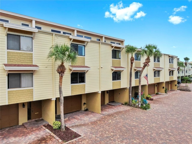459 Haven Point Dr, Treasure Island, FL 33706 - view of property with driveway, a residential view, and a garage