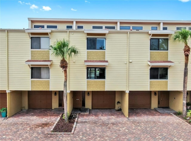 459 Haven Point Dr, Treasure Island, FL 33706 - view of building exterior featuring an attached garage