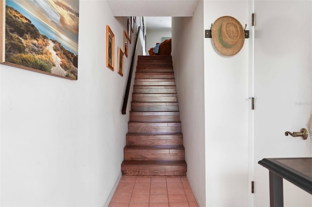 459 Haven Point Dr, Treasure Island, FL 33706 - stairs with tile patterned floors and baseboards