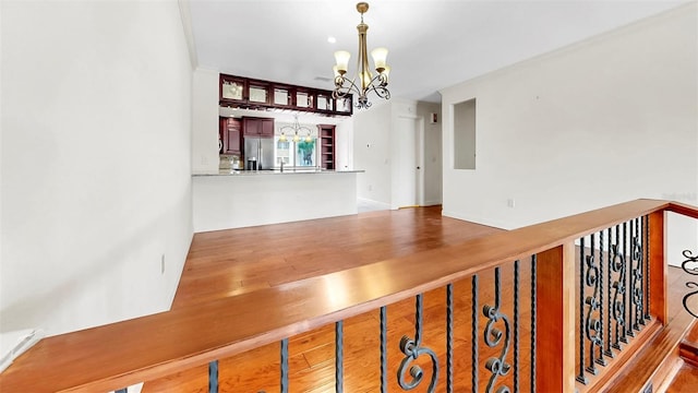 459 Haven Point Dr, Treasure Island, FL 33706 - stairs with a chandelier and wood finished floors