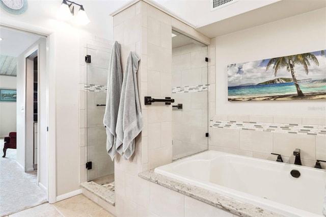 459 Haven Point Dr, Treasure Island, FL 33706 - full bath featuring a garden tub, tiled shower, and tile patterned flooring