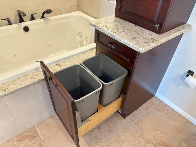 459 Haven Point Dr, Treasure Island, FL 33706 - bathroom with a jetted tub and baseboards