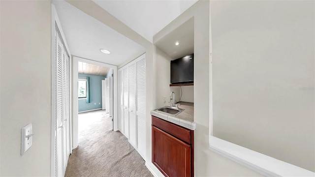 459 Haven Point Dr, Treasure Island, FL 33706 - corridor with light carpet and recessed lighting