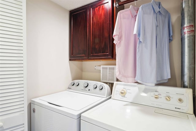 459 Haven Point Dr, Treasure Island, FL 33706 - laundry area with cabinet space and washer and dryer