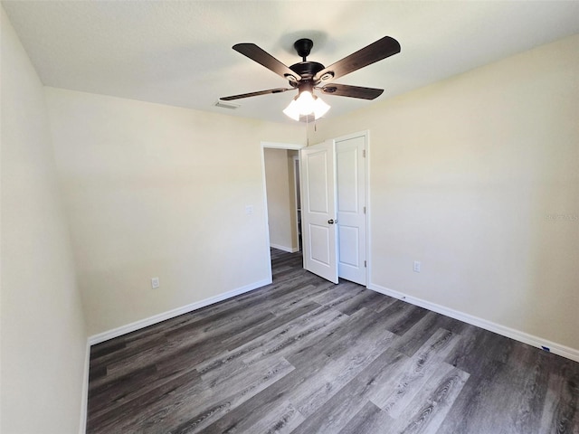 1557 S Martin Luther King Jr Ave, Clearwater, FL 33756 - unfurnished room with dark wood-style floors and a ceiling fan