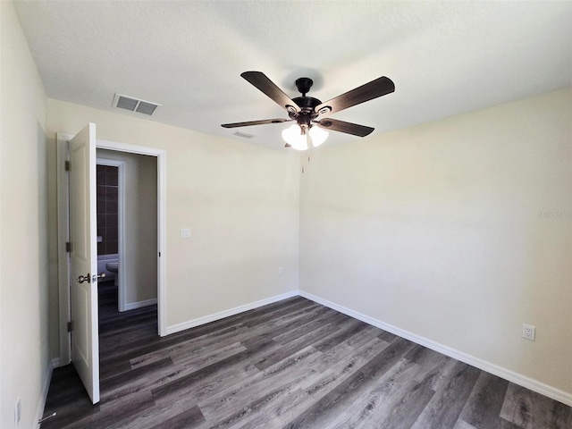 1557 S Martin Luther King Jr Ave, Clearwater, FL 33756 - spare room with dark wood-type flooring and a ceiling fan