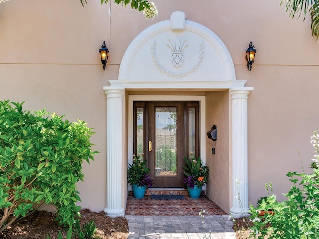 8 Sunset Bay Dr, Belleair, FL 33756 - view of exterior entry with stucco siding