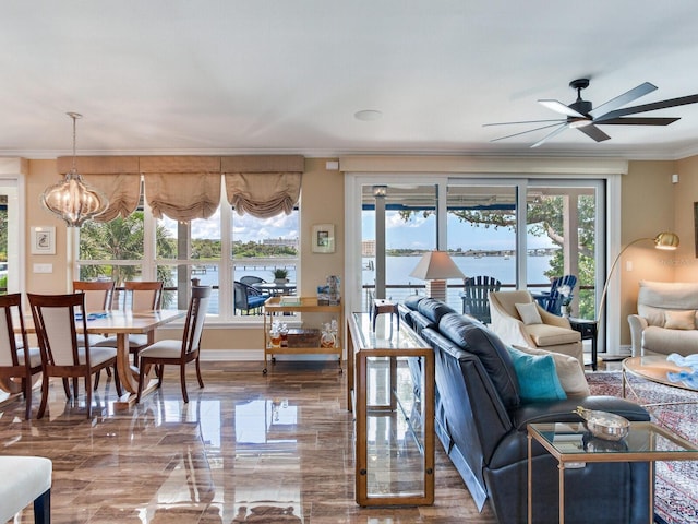 8 Sunset Bay Dr, Belleair, FL 33756 - living area with ornamental molding, ceiling fan, and a chandelier