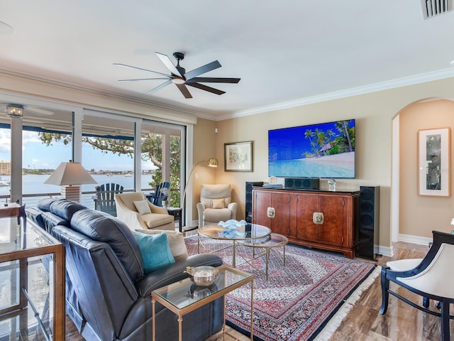 8 Sunset Bay Dr, Belleair, FL 33756 - living area featuring crown molding, a ceiling fan, and arched walkways