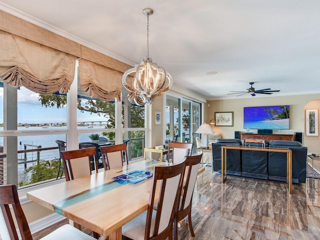 8 Sunset Bay Dr, Belleair, FL 33756 - dining room with a chandelier, ornamental molding, a ceiling fan, and a water view