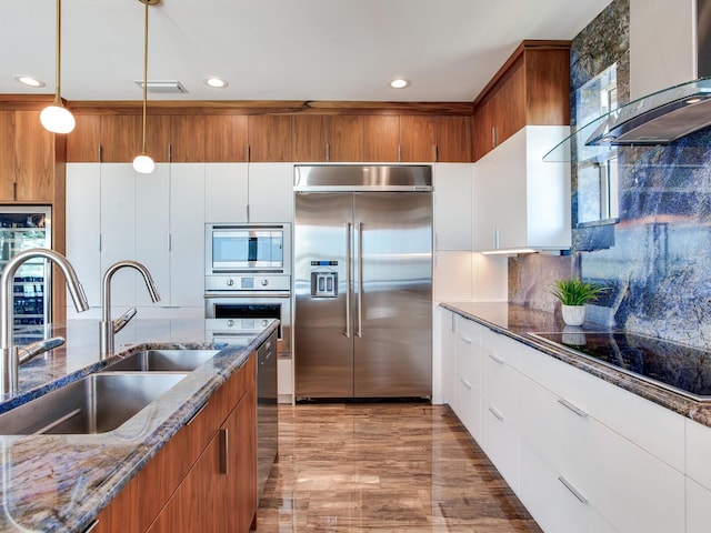 8 Sunset Bay Dr, Belleair, FL 33756 - kitchen featuring built in appliances, exhaust hood, hanging light fixtures, dark stone counters, and recessed lighting