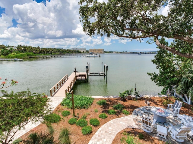 8 Sunset Bay Dr, Belleair, FL 33756 - dock area featuring boat lift, a water view, and a fire pit