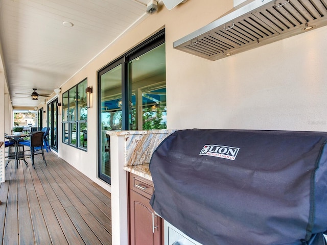 8 Sunset Bay Dr, Belleair, FL 33756 - wooden deck with outdoor dining area, a ceiling fan, and grilling area
