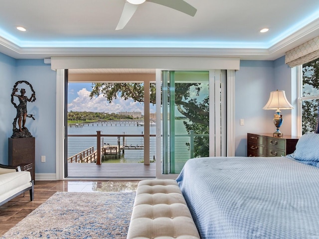 8 Sunset Bay Dr, Belleair, FL 33756 - bedroom featuring access to exterior, a water view, wood finished floors, ceiling fan, and recessed lighting