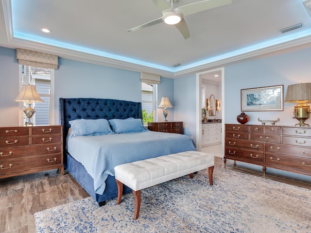 8 Sunset Bay Dr, Belleair, FL 33756 - bedroom featuring recessed lighting, ensuite bath, ceiling fan, wood finished floors, and a raised ceiling