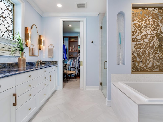 8 Sunset Bay Dr, Belleair, FL 33756 - bathroom with vanity, a stall shower, a garden tub, a walk in closet, and ornamental molding