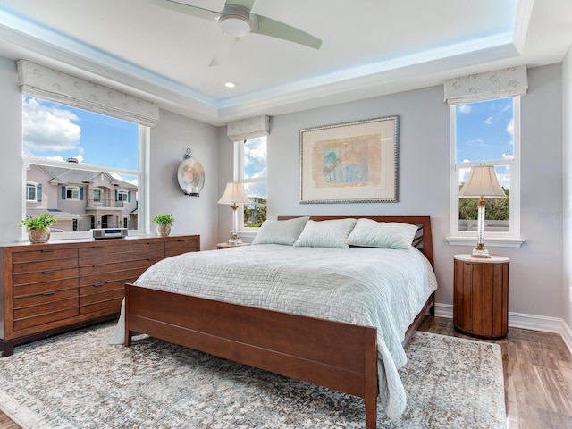 8 Sunset Bay Dr, Belleair, FL 33756 - bedroom with a tray ceiling, multiple windows, and recessed lighting