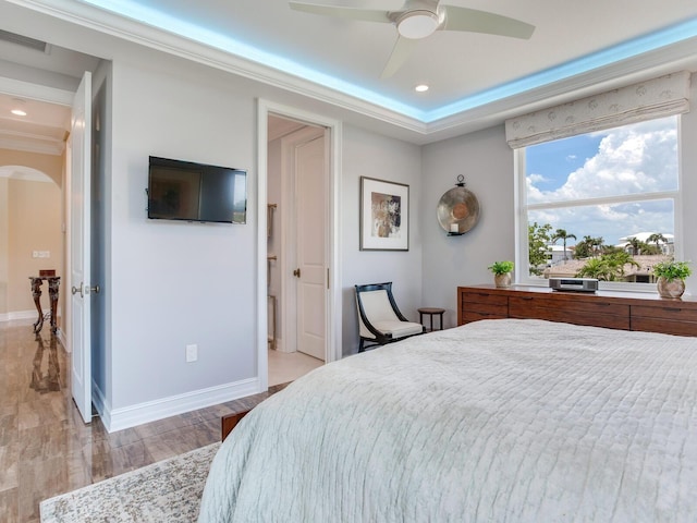 8 Sunset Bay Dr, Belleair, FL 33756 - bedroom with arched walkways, ornamental molding, wood finished floors, recessed lighting, and ceiling fan