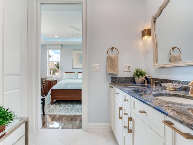 8 Sunset Bay Dr, Belleair, FL 33756 - ensuite bathroom featuring double vanity and tile patterned floors